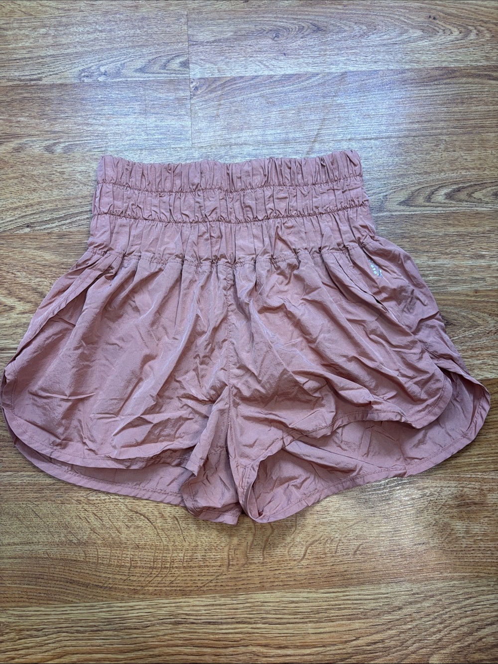 FP Movement by Free People Smocked Waist Athletic Shorts in Rust